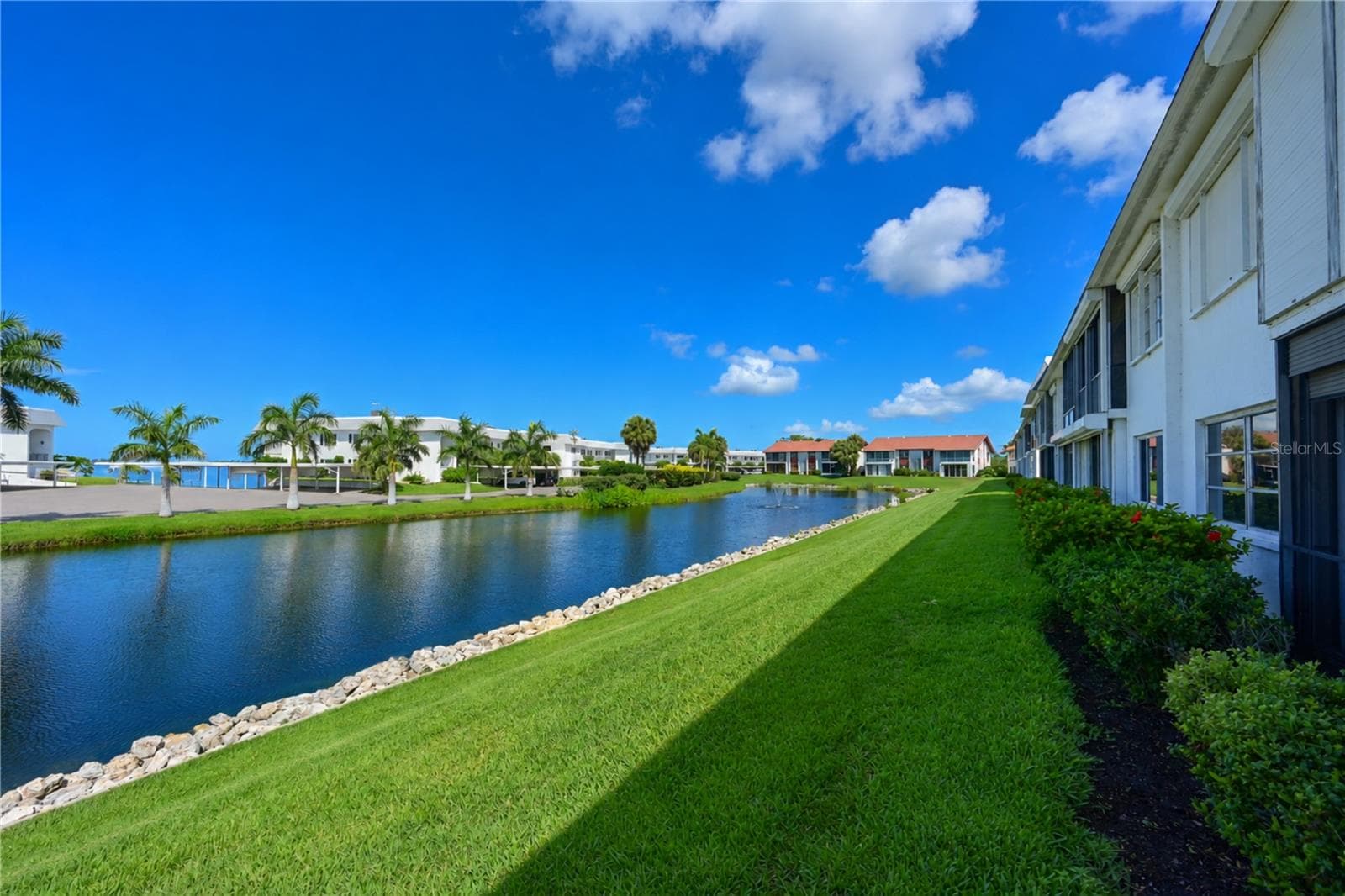 View across back of condo towards clubhouse - 4809 INDEPENDENCE DR, BRADENTON