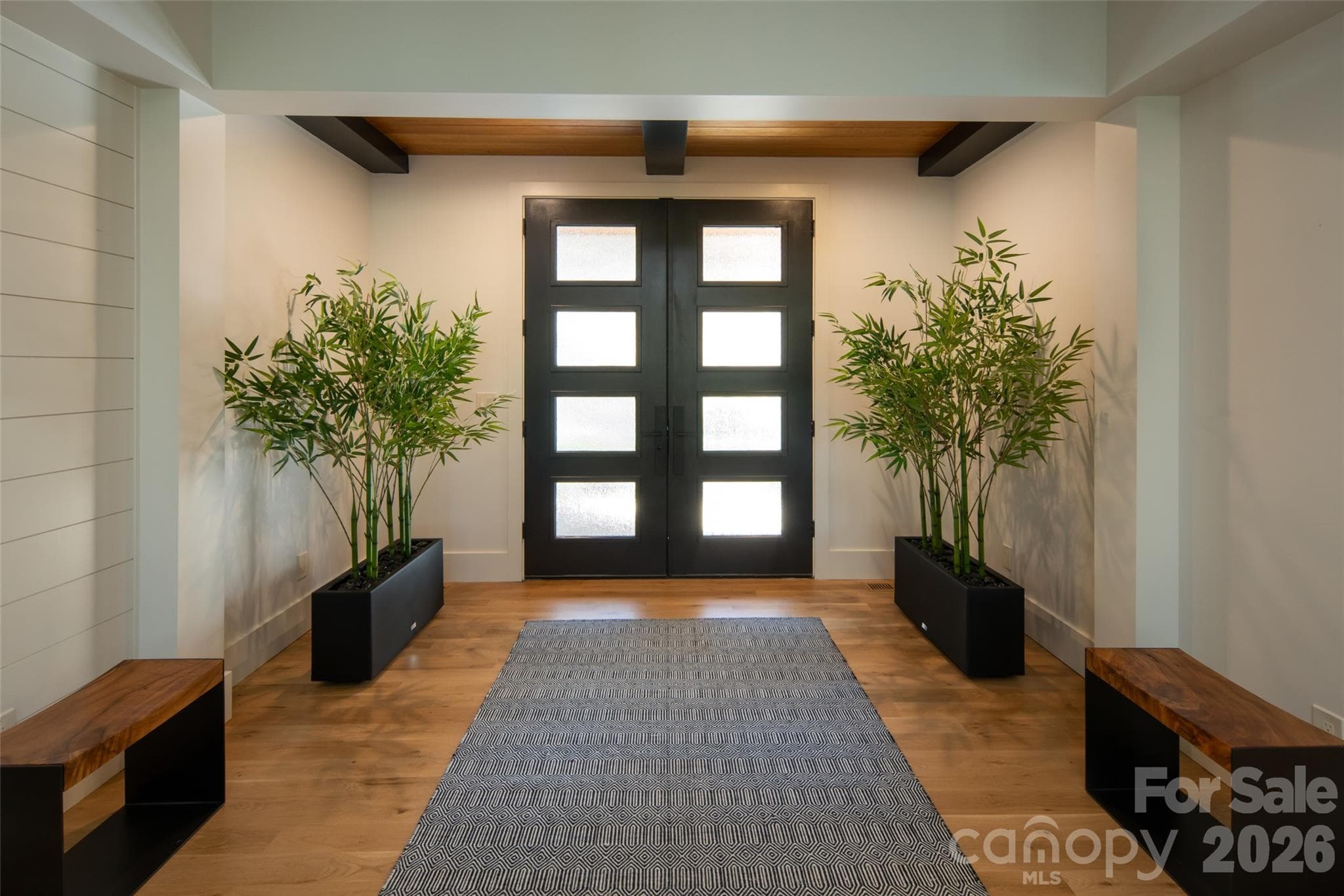 Interior entryway with coffered/beam ceiling and custom nickel gap walls. - Asheville