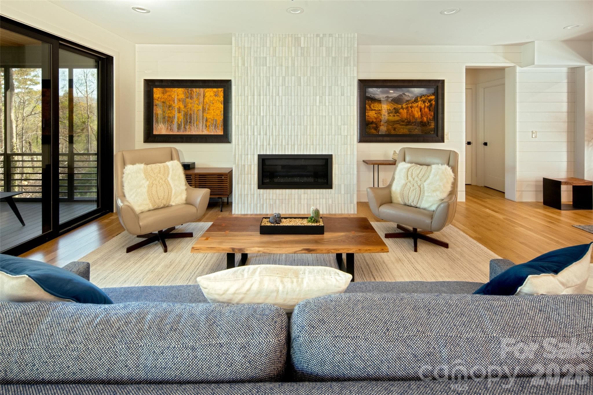 Floor to ceiling gas fireplace with custom tile surround. Nickel gap walls throughout main level living room spaces. - Asheville