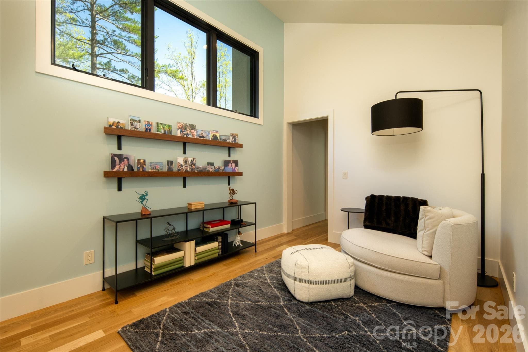 Relax in your second floor living room. The perfect spot to curl up and read a book, watch TV, or just use as a hang-out space for the upper level guest bedrooms. - Asheville