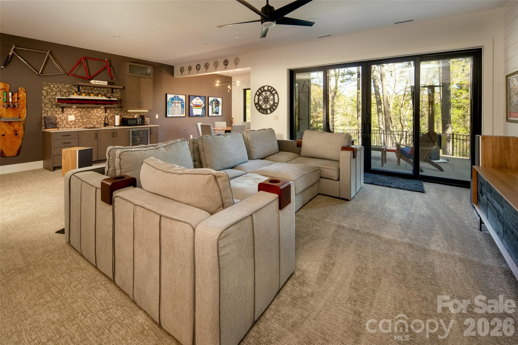 The lower level is a DREAM entertaining space!! This monstrously large living area offers room for home theater, dining, and refreshments! Pictures don't adequately capture the size of this space. - Asheville