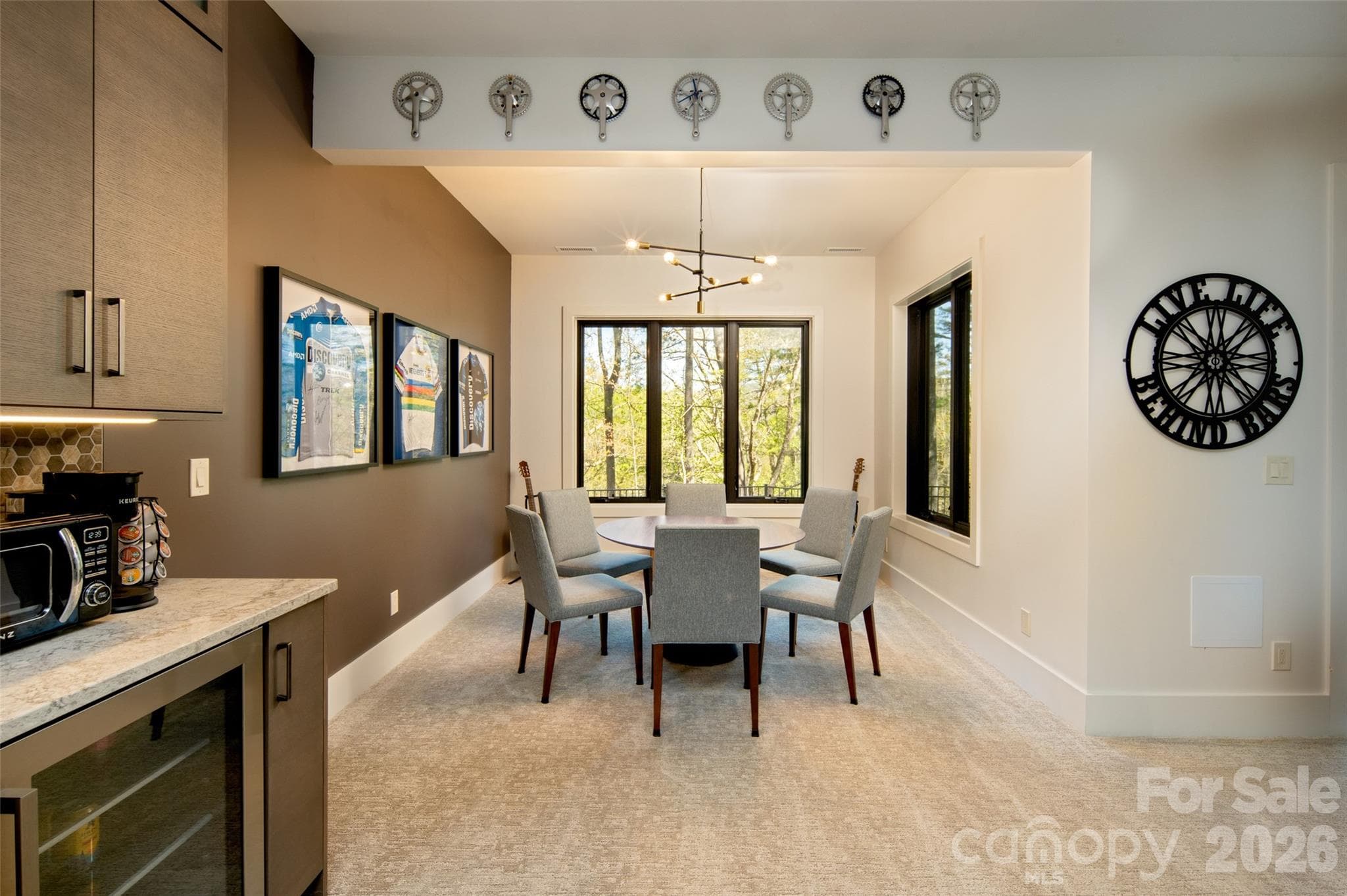Yet another seating area can be used for additional dining, game night, crafting or even an artist studio area (tons of great light!). - Asheville