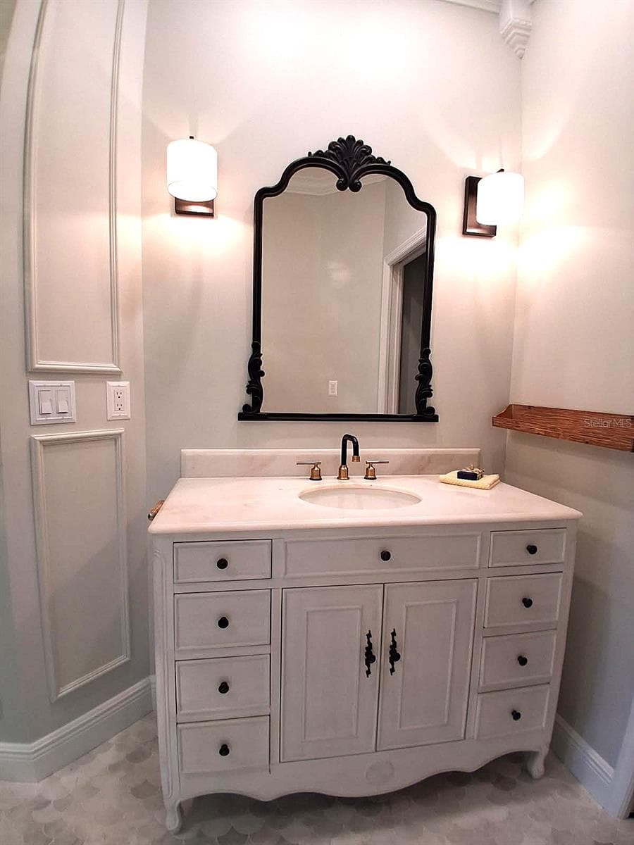 Attention to detail, New Lighting , Wall Molding and Crown Molding. New Stand alone sink, marble Floors - 3171 DICK WILSON DR, SARASOTA