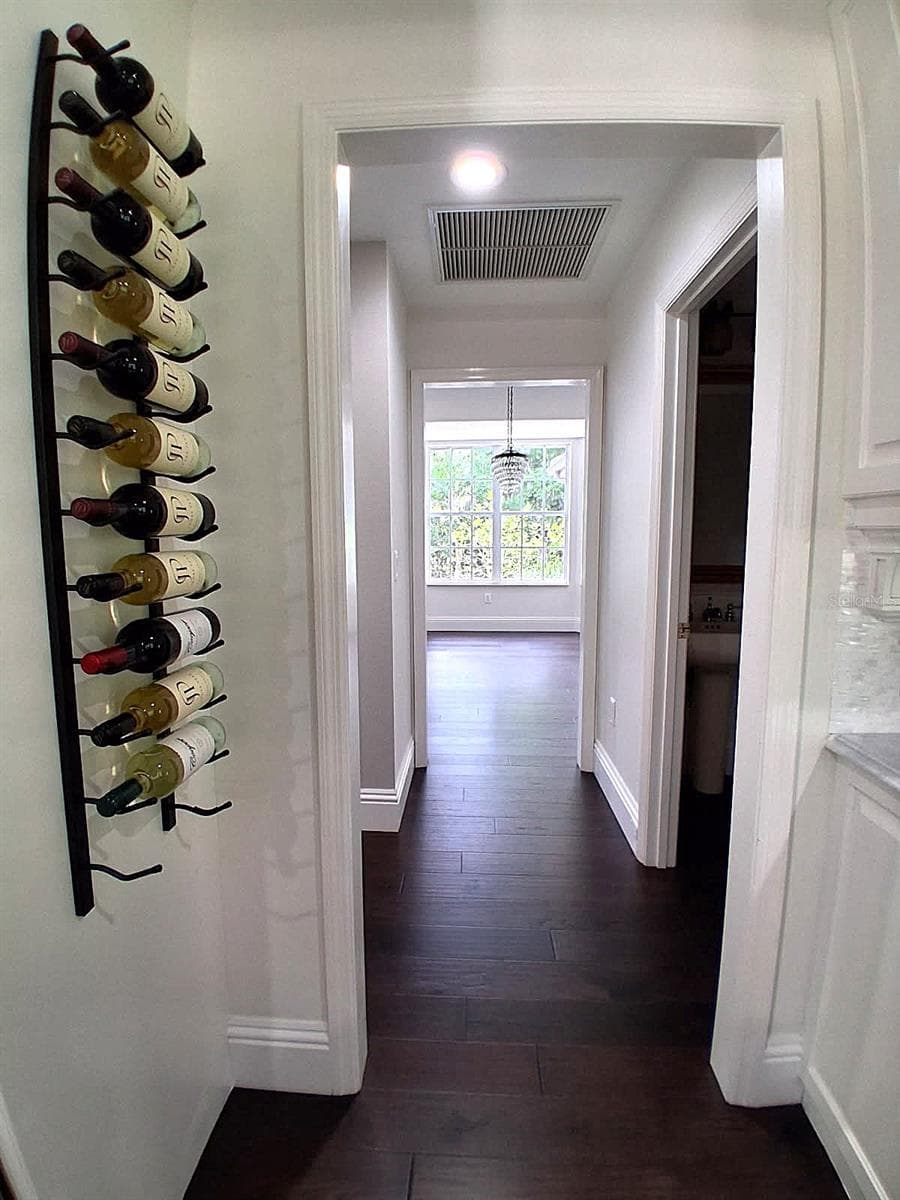 Entry to Formal Dining Room with Hallway to Powder room and 2 storage Closets - 3171 DICK WILSON DR, SARASOTA