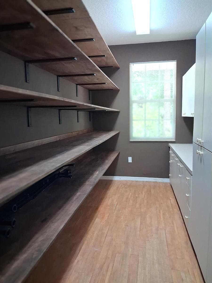 Heated/Cooled Garage Storage Rm. New shelving. Window for Natural Light - 3171 DICK WILSON DR, SARASOTA