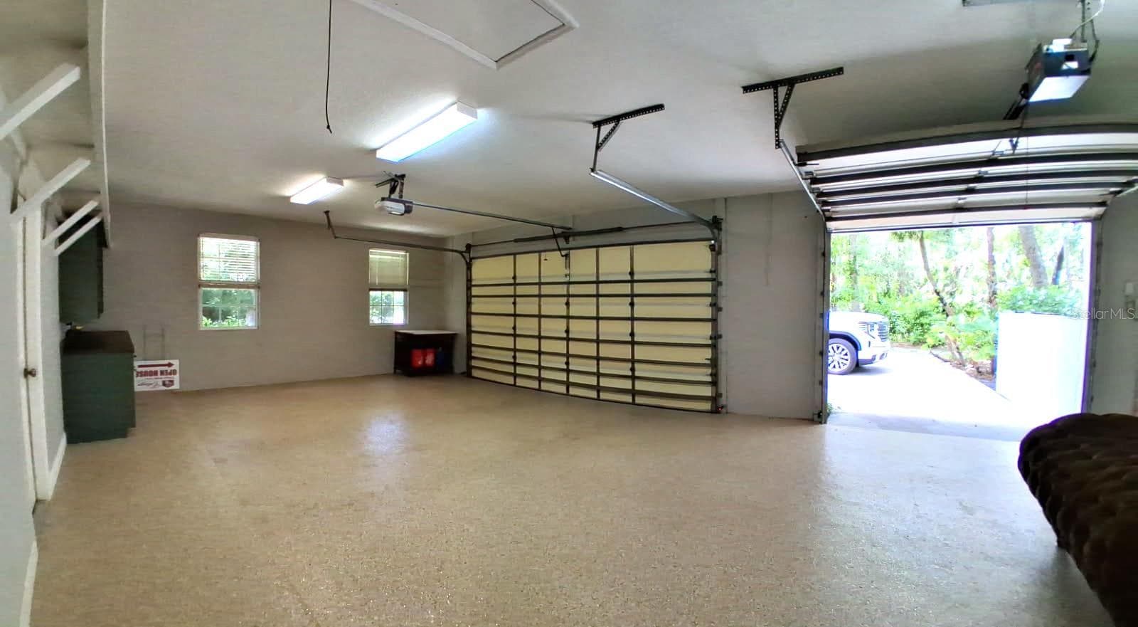 3 Car Garage New Epoxy Floors with Gold fleck added . New opener. Newly painted - 3171 DICK WILSON DR, SARASOTA