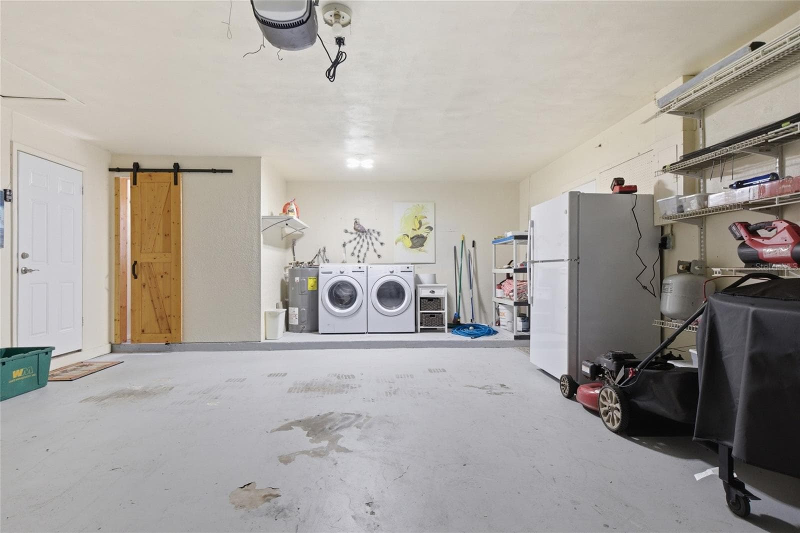Two stall garage with bathroom, washer, dryer, extra refrigerator - 52 ANNAPOLIS LN, ROTONDA WEST