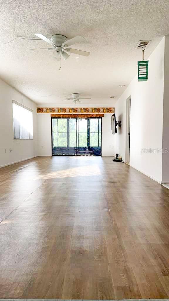 Dining room/living room to back patio/lanai. - 12922 WEDGEWOOD WAY #A, HUDSON