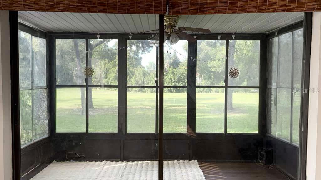 Patio/lanai that faces out to the golf course. - 12922 WEDGEWOOD WAY #A, HUDSON