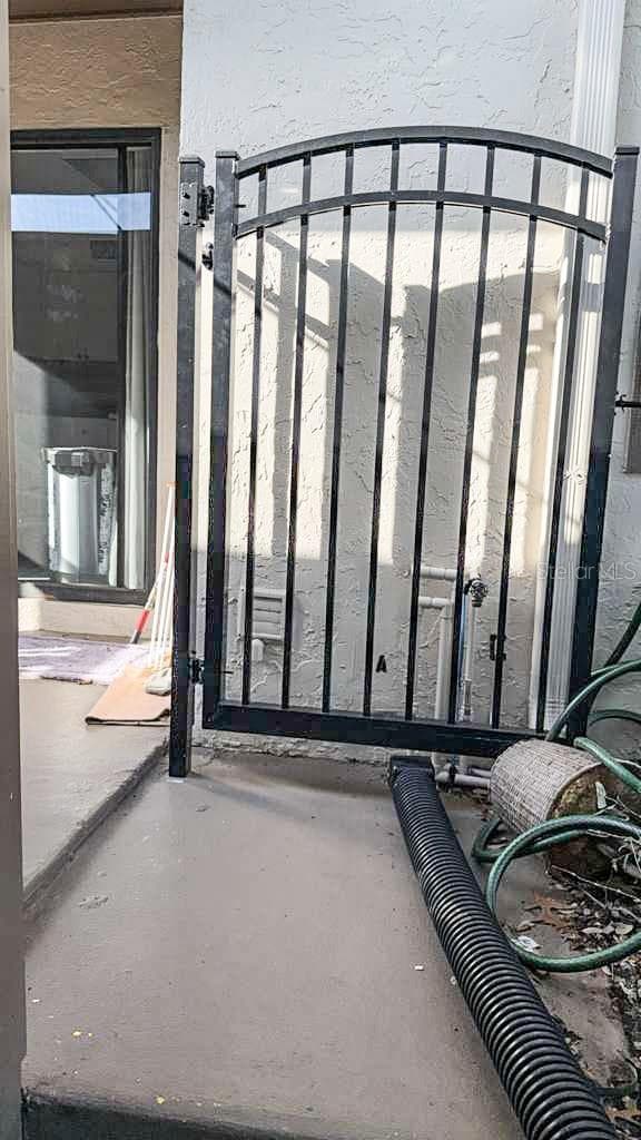 The gate to your private front patio/courtyard - 12922 WEDGEWOOD WAY #A, HUDSON