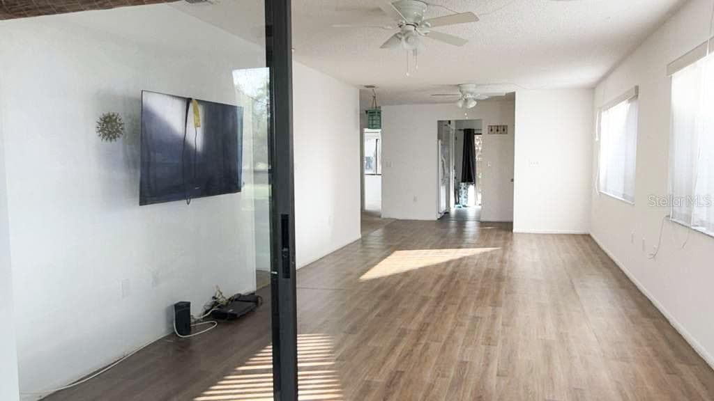 From back porch to living room dining room combo - 12922 WEDGEWOOD WAY #A, HUDSON