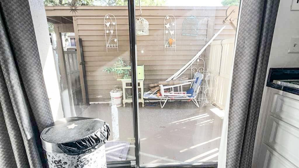 Back patio view from the kitchen - 12922 WEDGEWOOD WAY #A, HUDSON