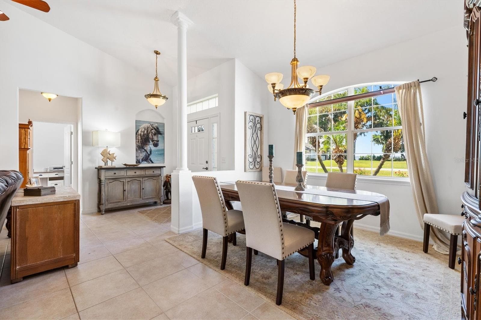 Large formal dining area with seating for eight, perfect for entertaining family and friends. - 12107 EAGLE POINT CT, LEESBURG