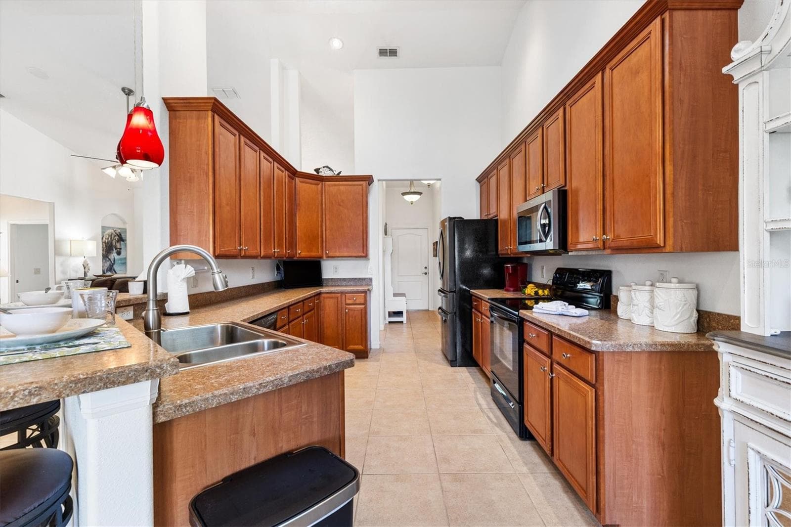 Chef’s kitchen featuring abundant cabinetry, a spacious pantry, and a cozy kitchen nook perfect for casual dining or morning coffee. - 12107 EAGLE POINT CT, LEESBURG