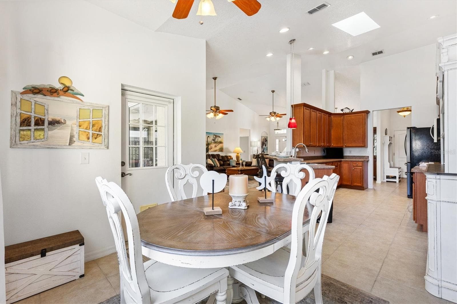 The rear kitchen nook offers the perfect spot to enjoy the morning paper, relax with your Kindle, or create a cozy craft space filled with natural light. - 12107 EAGLE POINT CT, LEESBURG