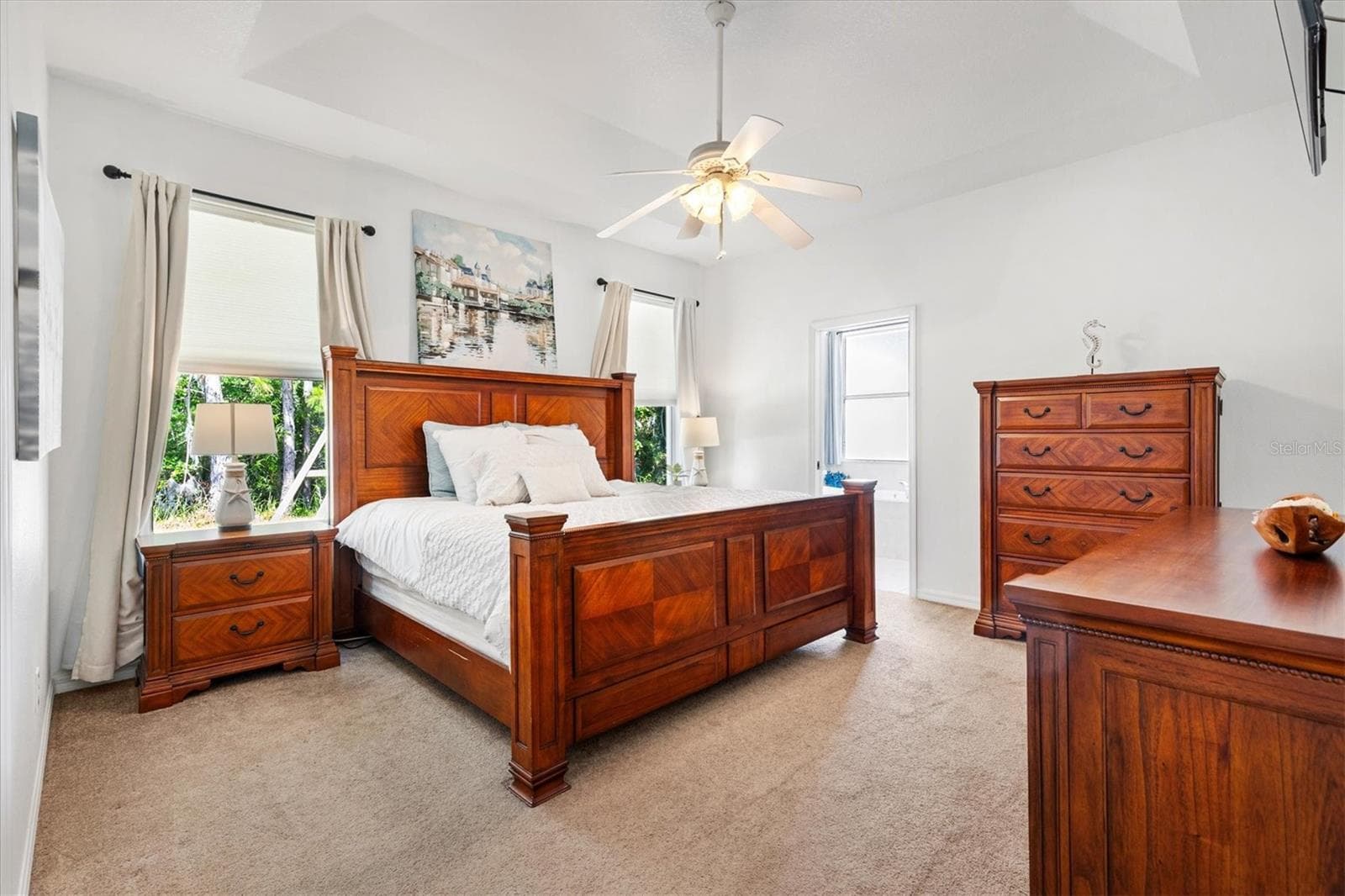 Spacious primary suite featuring a huge walk-in closet and an ensuite bathroom complete with a relaxing garden tub. - 12107 EAGLE POINT CT, LEESBURG