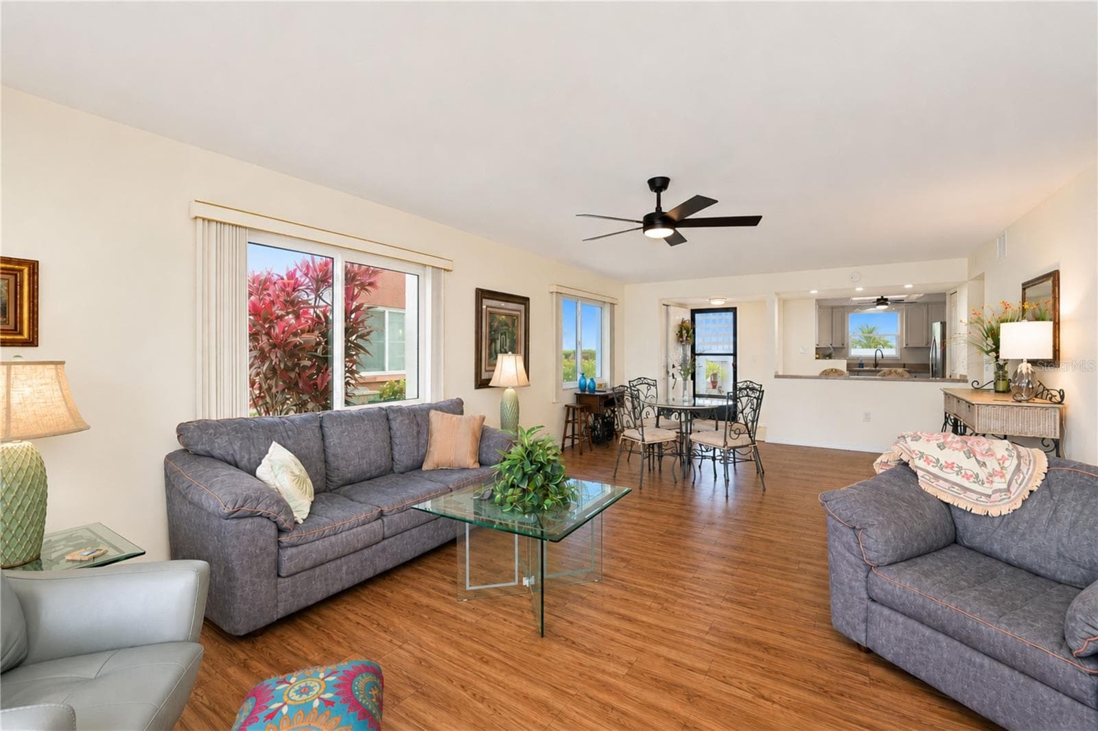 Back inside the entertaining area featuring the planking flooring - 4853 INDEPENDENCE DR, BRADENTON