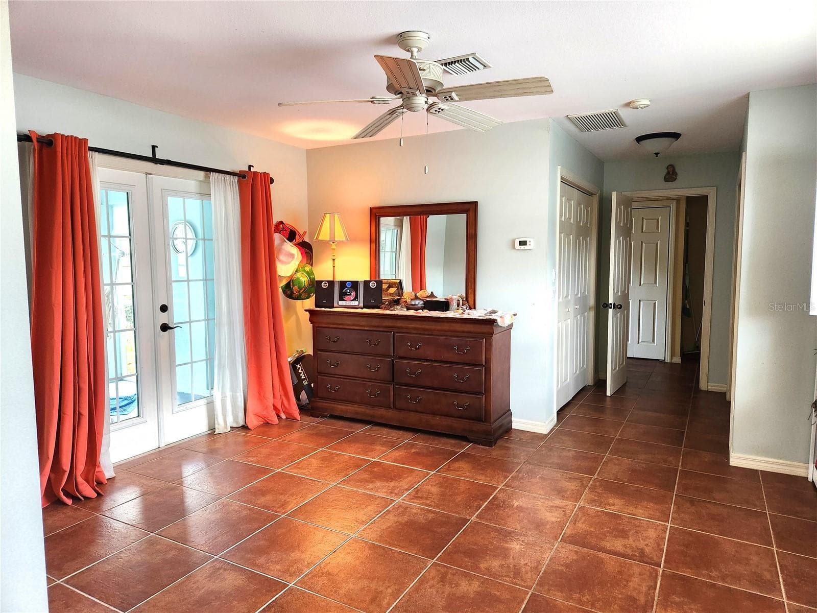 The primary bedroom, featuring an expansive layout that comfortably accommodates both sleeping area and a designated area suitable for a relaxing sitting space, thereby enhancing the overall functionality and comfort of the room. - 316 ALBA ST E, VENICE
