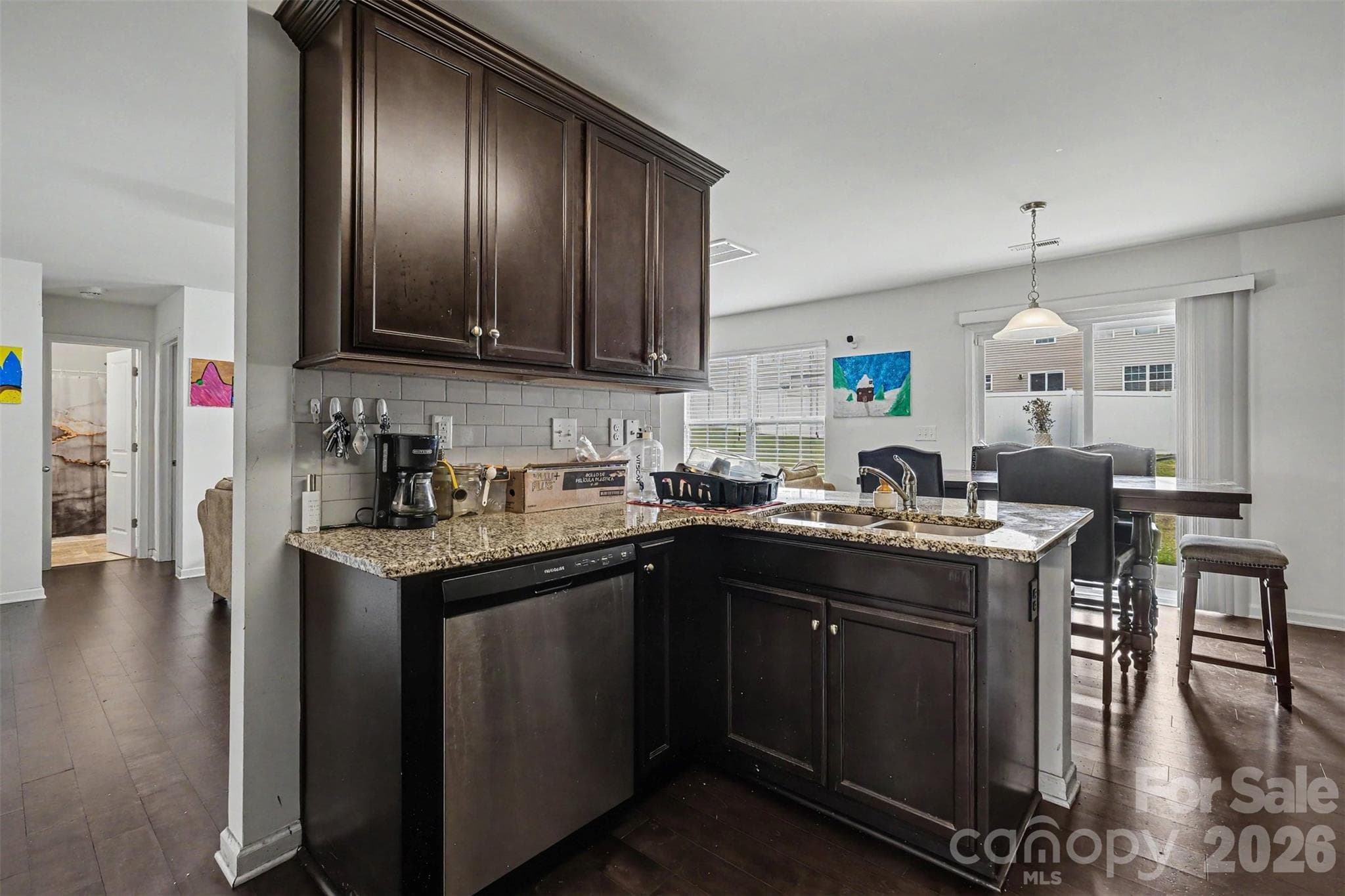 Kitchen into dining area - 8515 Mansell Court, Charlotte
