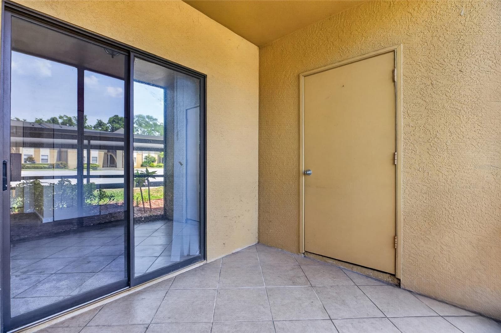 The front lanai has a storage closet. - 10125 SAILWINDS BLVD N #104, LARGO