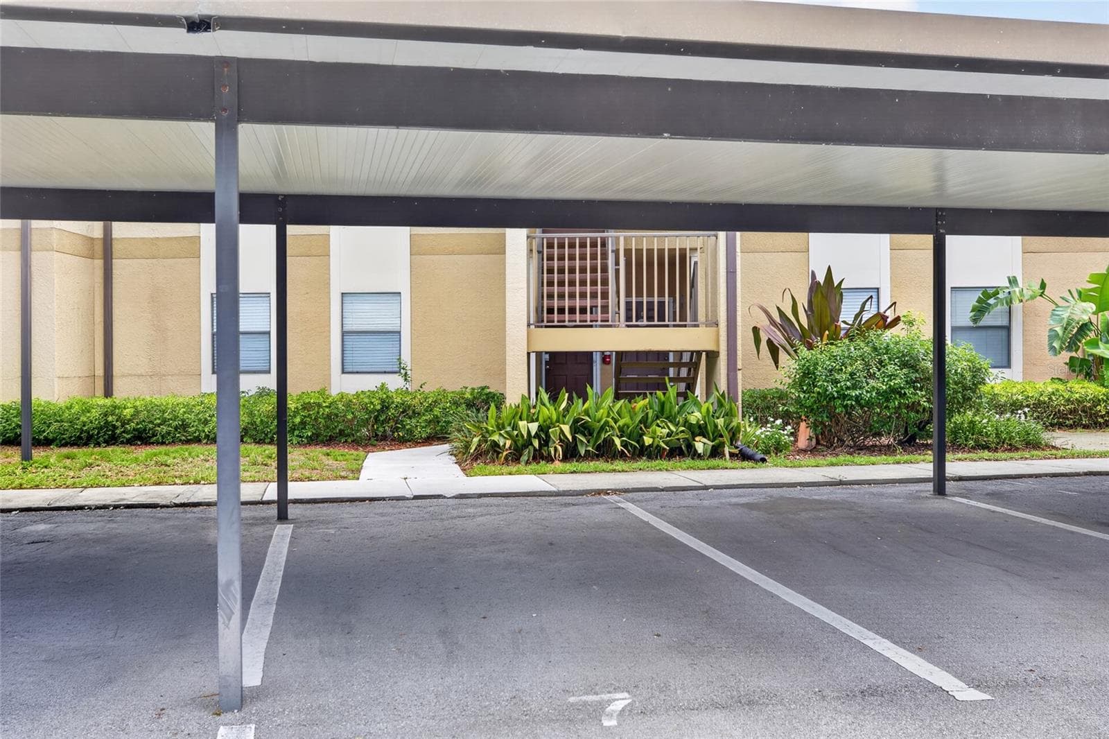 The condo comes with a reserved carport space. - 10125 SAILWINDS BLVD N #104, LARGO