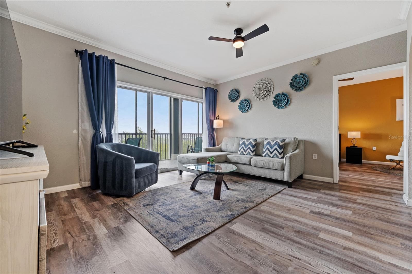 Living room looking into Primary suite - 14200 AVALON RD #409, WINTER GARDEN