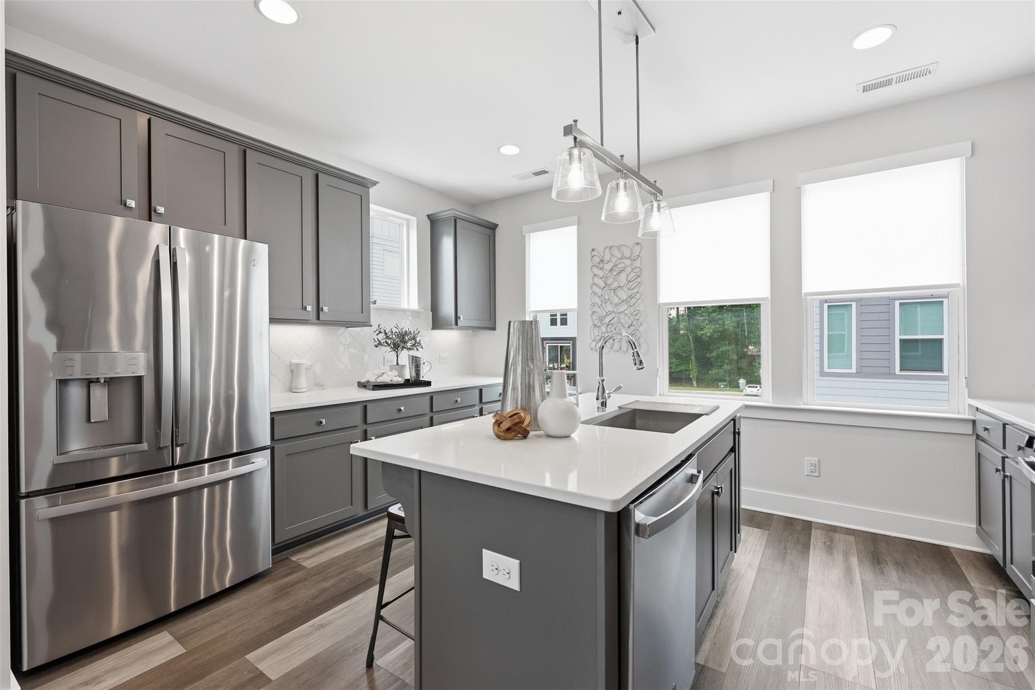 Beautiful kitchen with stainless appliances, and a large island. Perfect for any cook! Refrigerator conveys with home! - 2148 Electric Lane, Charlotte