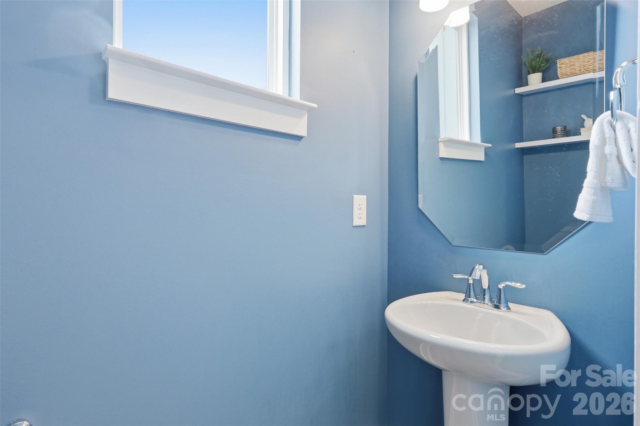 Convenient powder room for guests in the main level. - 2148 Electric Lane, Charlotte