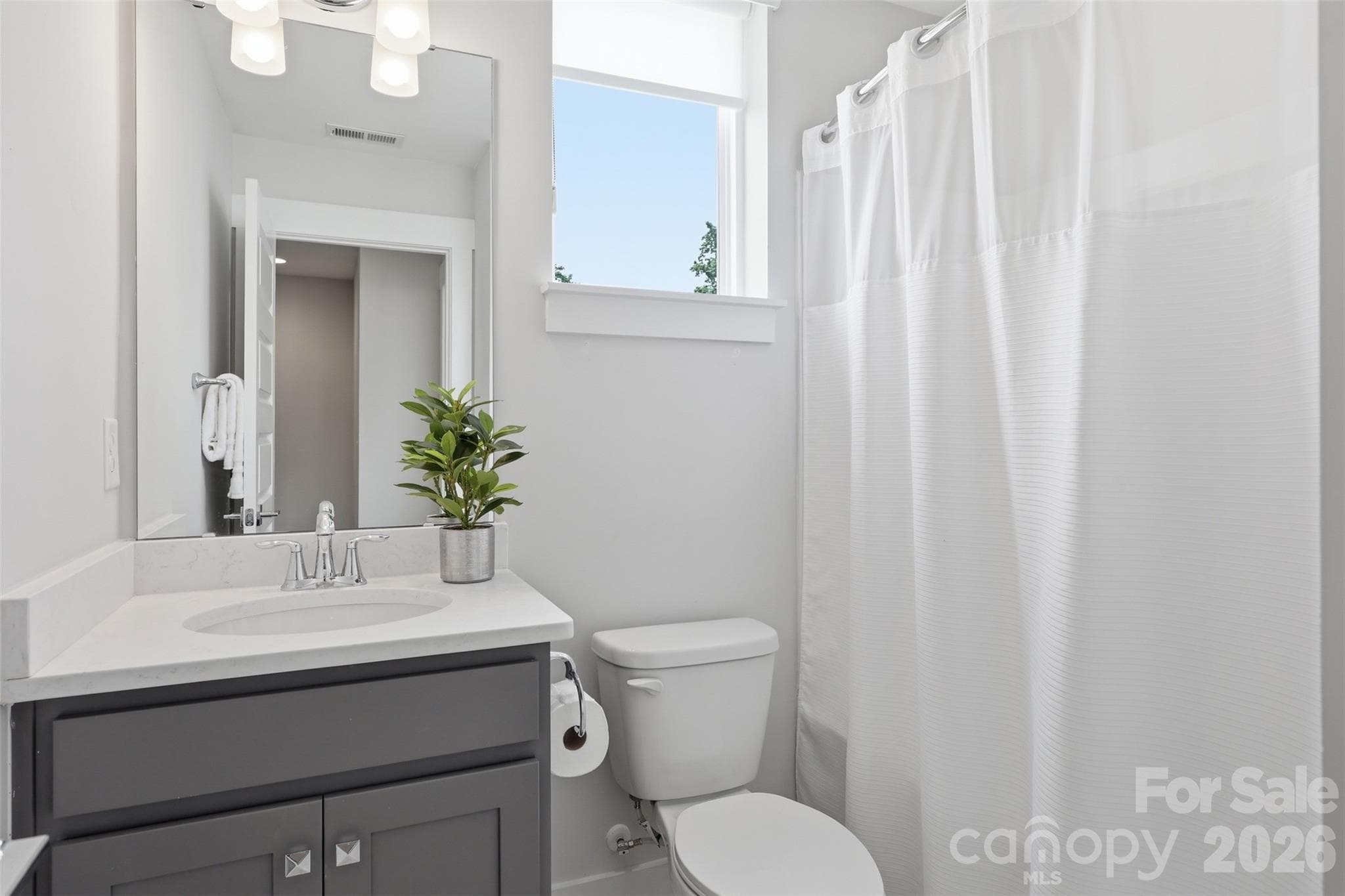 Convenient guest bath next door to guest bedroom. - 2148 Electric Lane, Charlotte