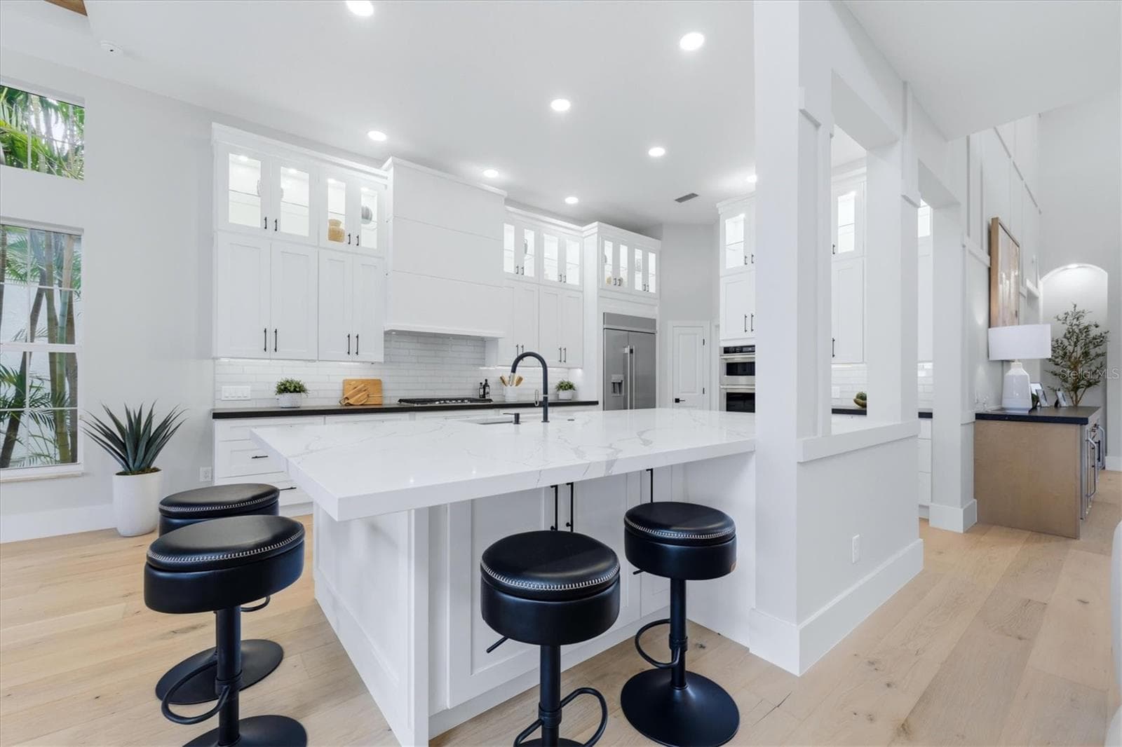 Kitchen has Oversized Island with Mitered Edge Quartz Countertops and New Appliances, Shaker Style Cabinets and Cabinet Lighting - 3606 FAIR OAKS PL, LONGBOAT KEY