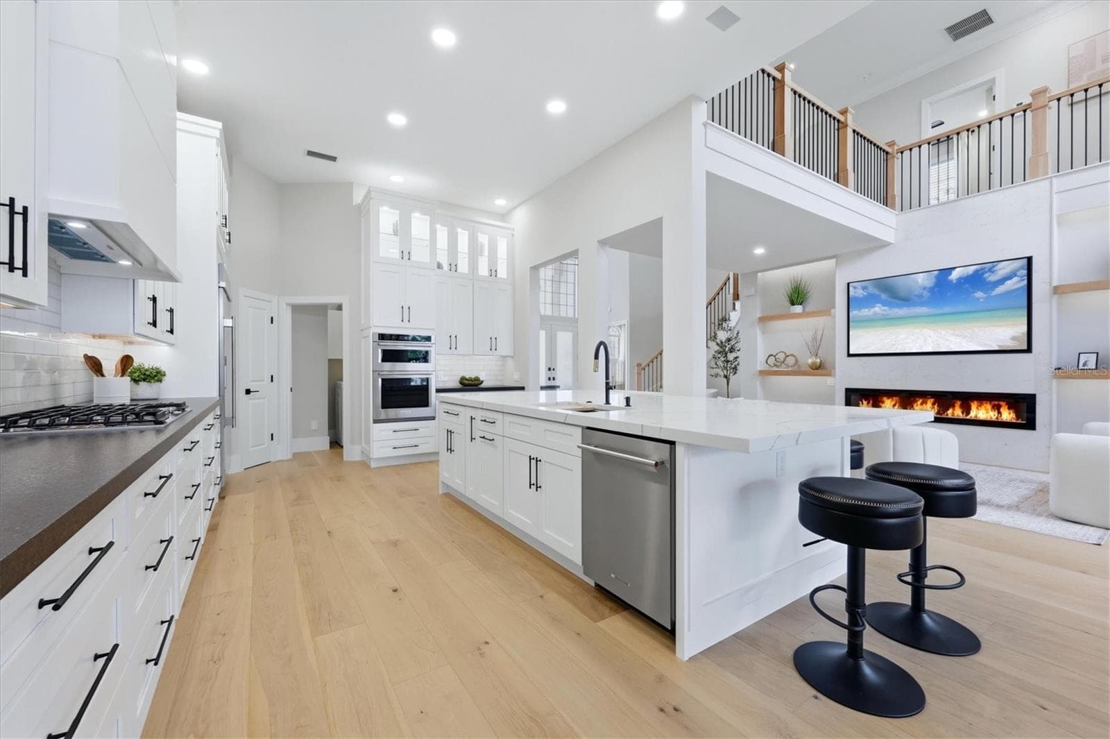 Kitchen has Oversized Island with Mitered Edge Quartz Countertops and New Appliances, Shaker Style Cabinets and Cabinet Lighting - 3606 FAIR OAKS PL, LONGBOAT KEY