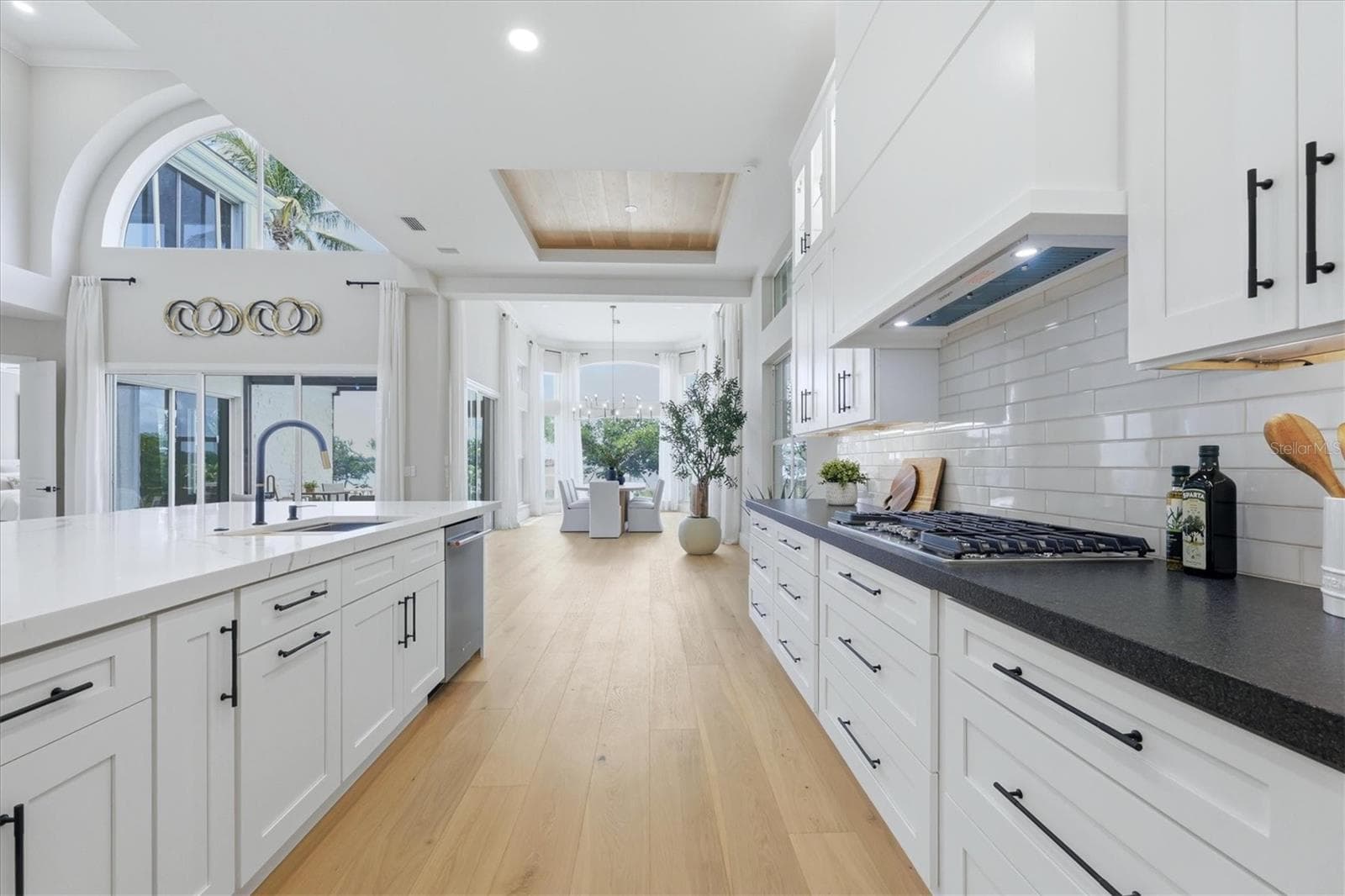 View of Dining Room from the Kitchen - 3606 FAIR OAKS PL, LONGBOAT KEY