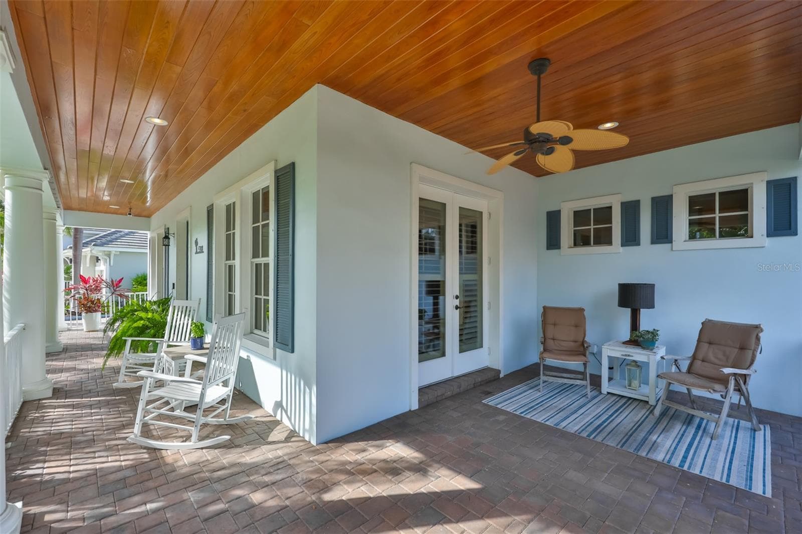 view of wrap around porch with side doors into study/library - 5318 LOON NEST CT, APOLLO BEACH