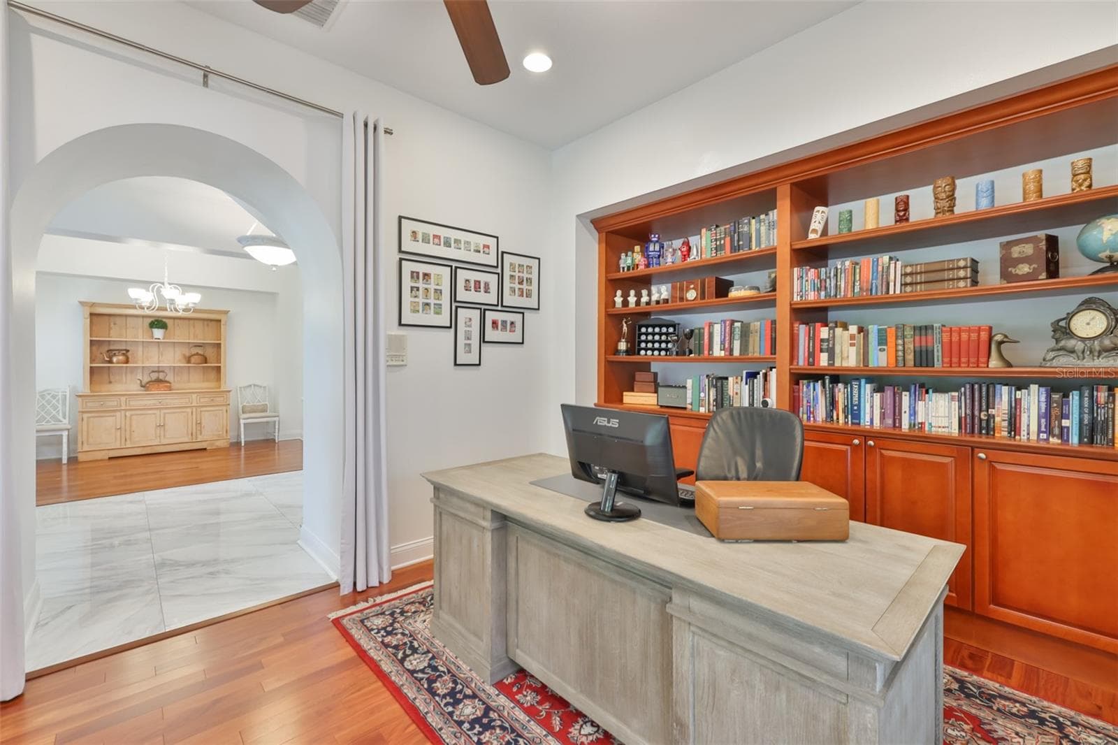 beautiful arch entry from study to foyer. white drapes installed over entrance give extra privacy - 5318 LOON NEST CT, APOLLO BEACH