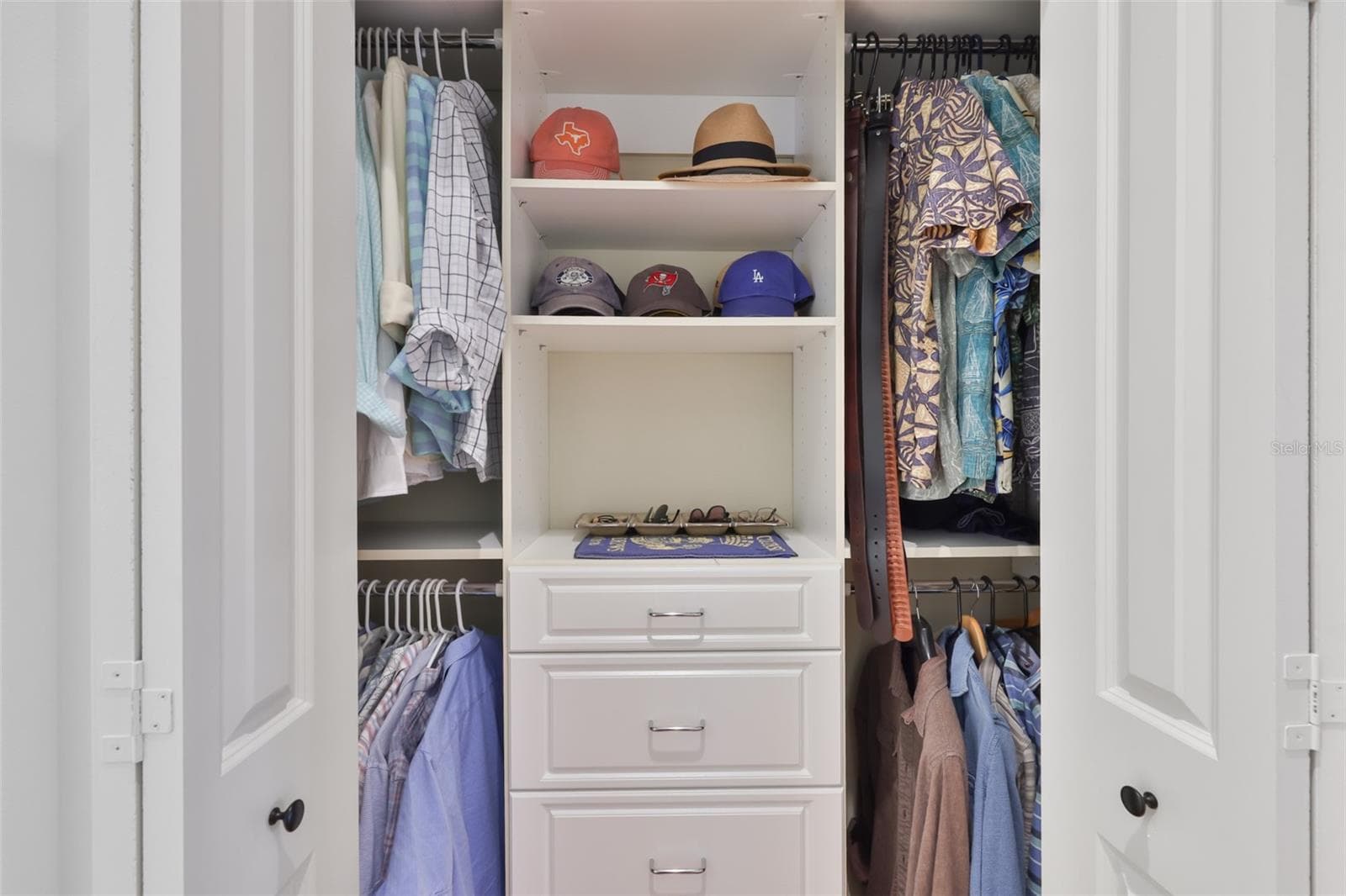 folding door master closet with built-ins - 5318 LOON NEST CT, APOLLO BEACH
