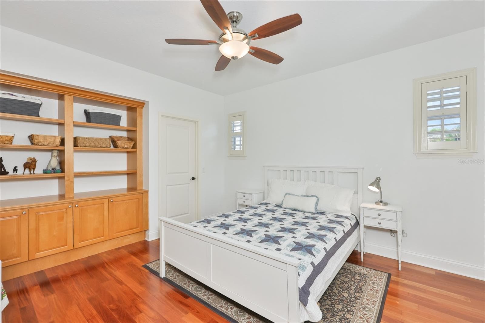 upstairs secondary bedroom with solid wood built in cabintry and shelving - 5318 LOON NEST CT, APOLLO BEACH