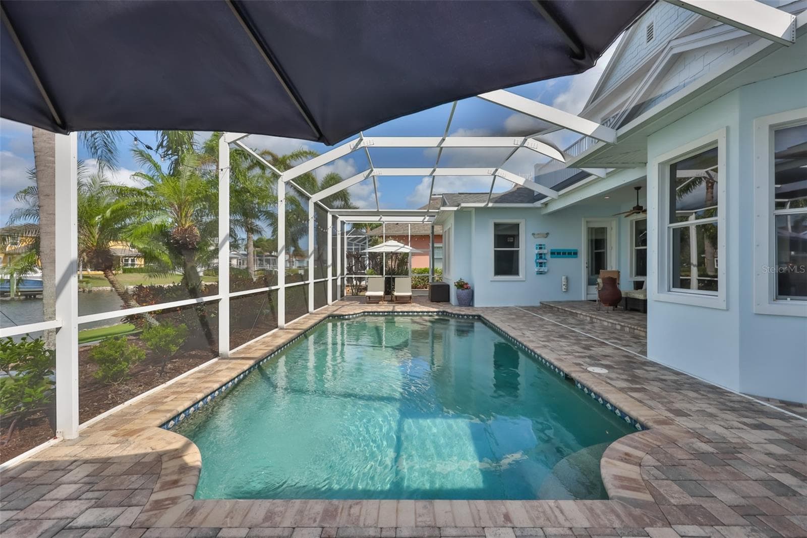 peaceful pool with canal views - 5318 LOON NEST CT, APOLLO BEACH
