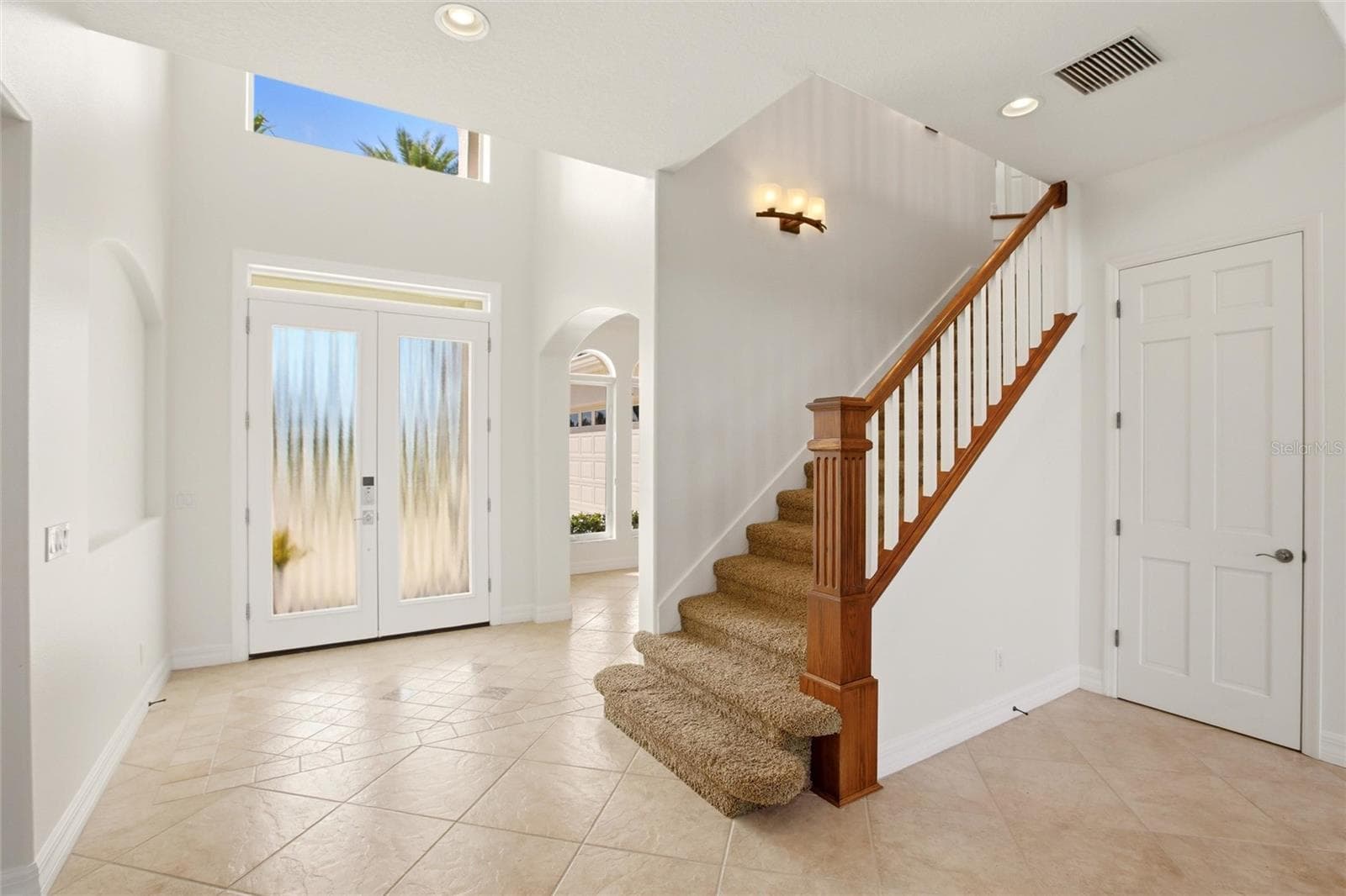 A dramatic two-story foyer welcomes you into the home. - 8417 LONE EAGLE WAY, SARASOTA