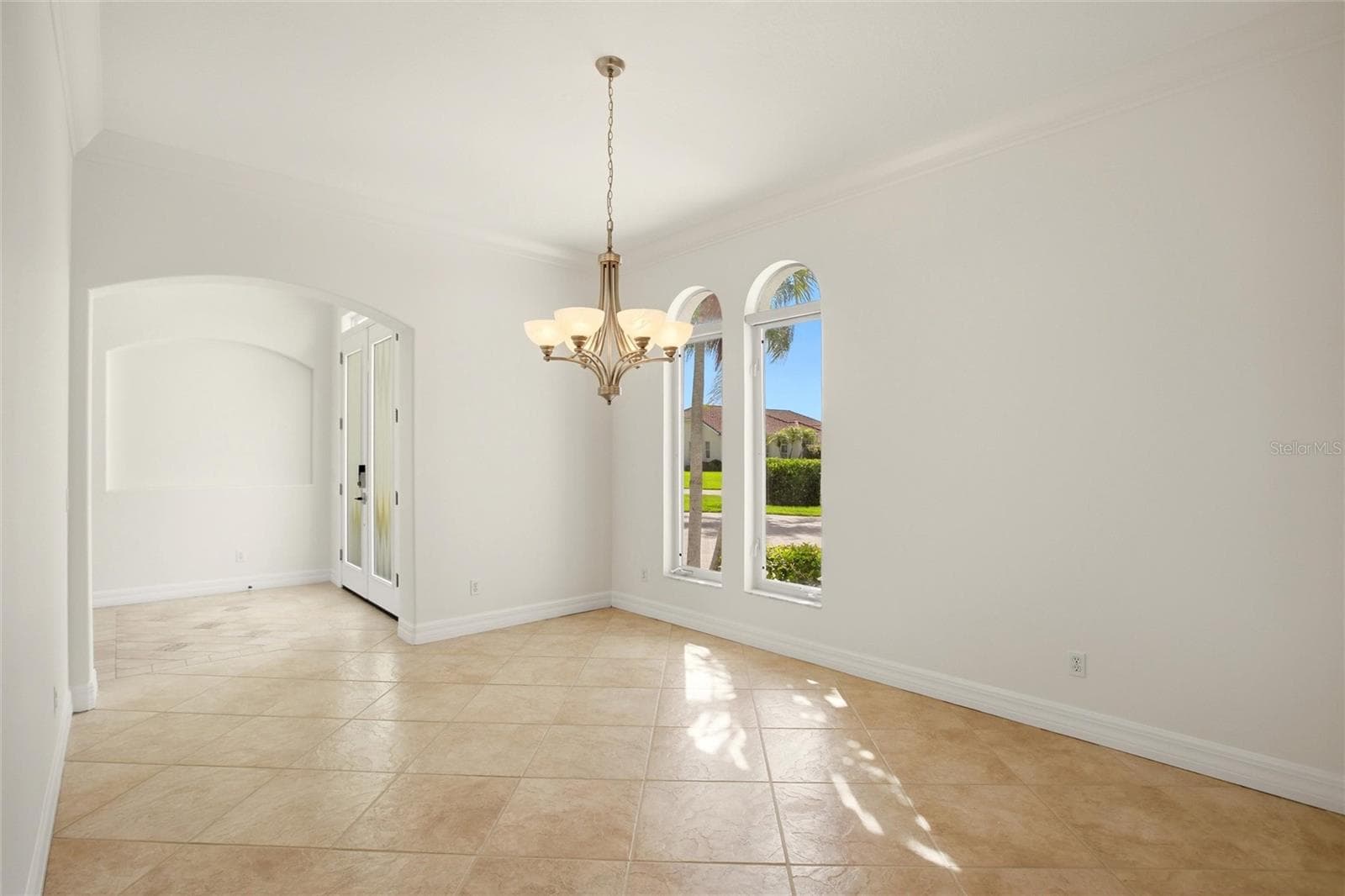 A separate dining room is conveniently located just off the kitchen and features built-in cabinetry, offering both elegance and functional storage. - 8417 LONE EAGLE WAY, SARASOTA