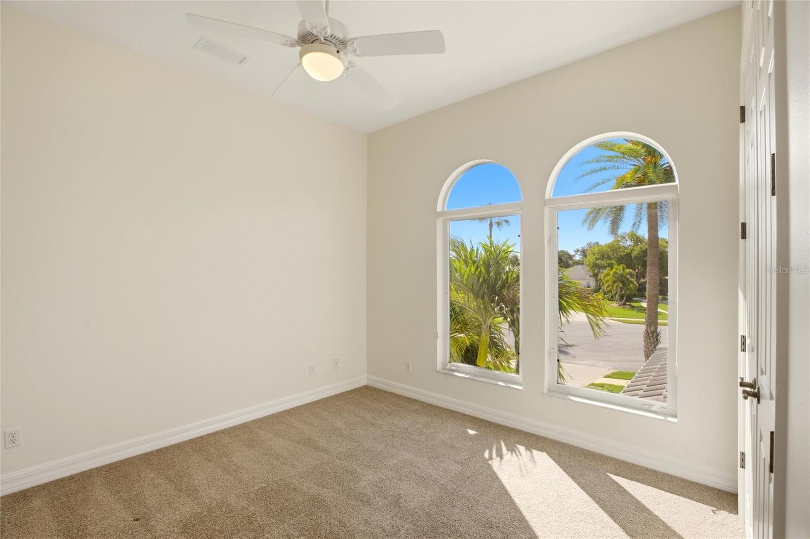 The bedroom features a built-in closet and convenient access to a nearby hall bathroom. - 8417 LONE EAGLE WAY, SARASOTA