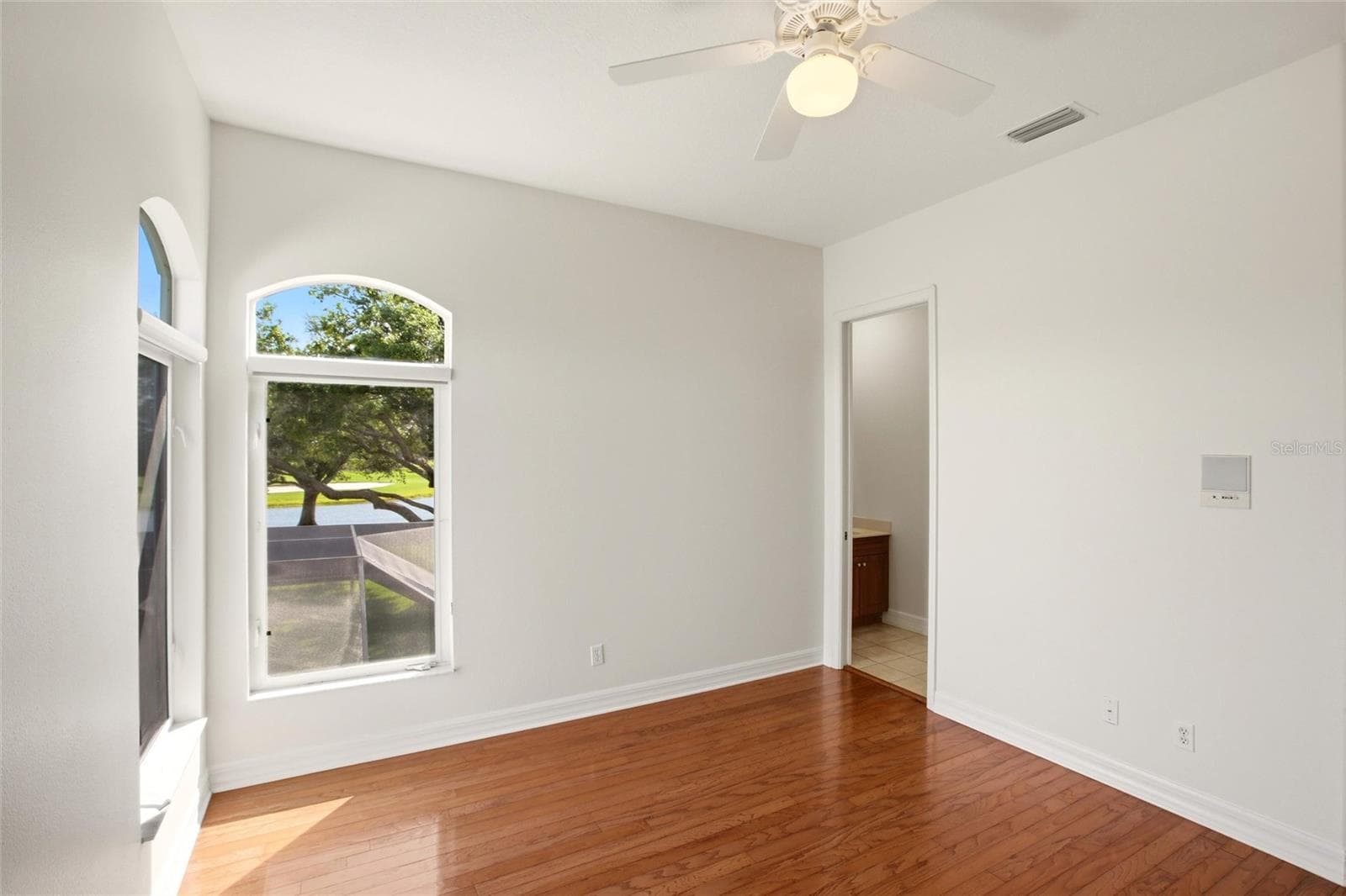 The Jack-and-Jill suites feature hardwood flooring and well-appointed bathrooms with a shower/tub combination, walk-in closets, and a private water closet. - 8417 LONE EAGLE WAY, SARASOTA