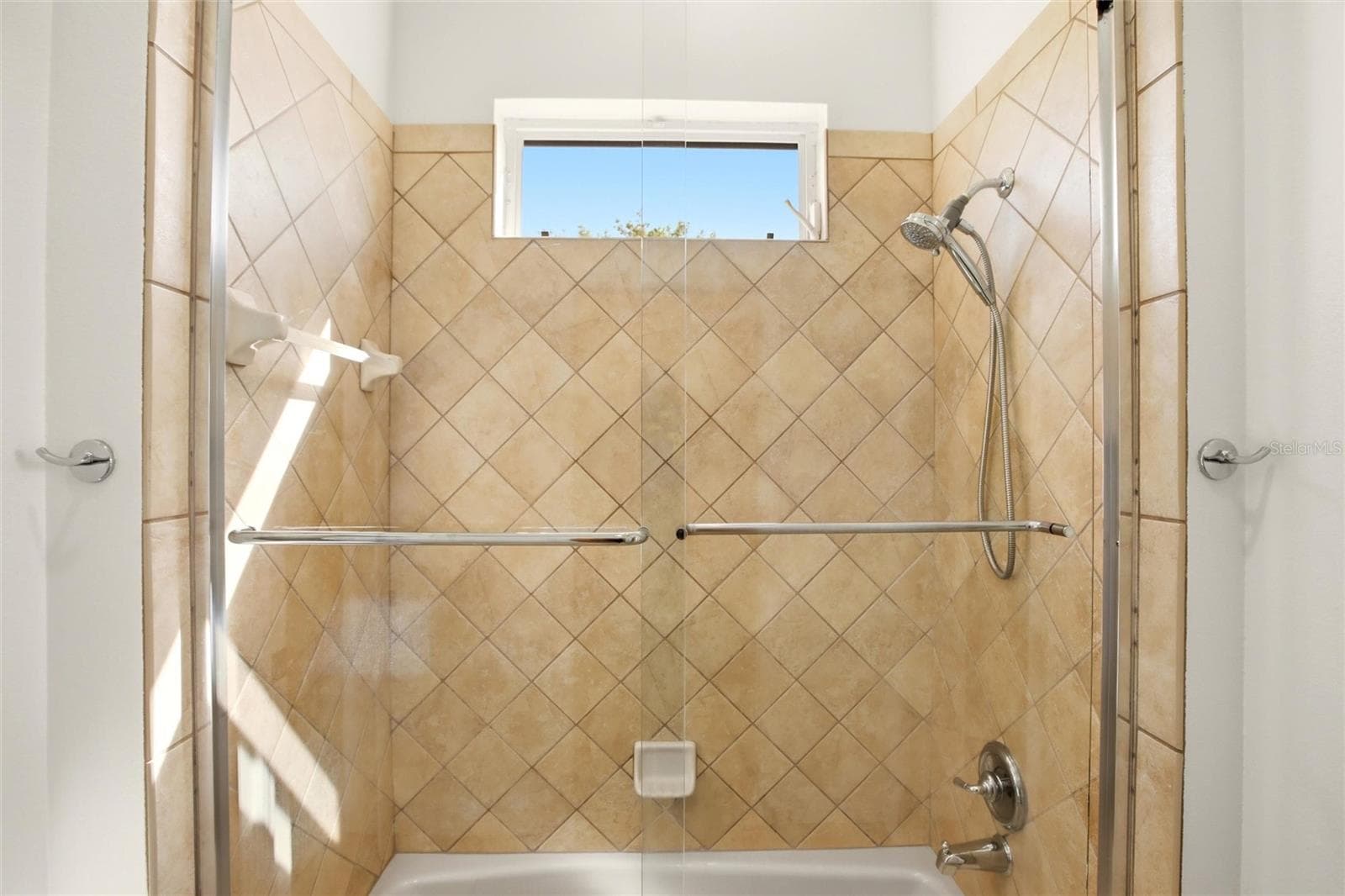 The Jack-and-Jill suites feature hardwood flooring and well-appointed bathrooms with a shower/tub combination, walk-in closets, and a private water closet. - 8417 LONE EAGLE WAY, SARASOTA