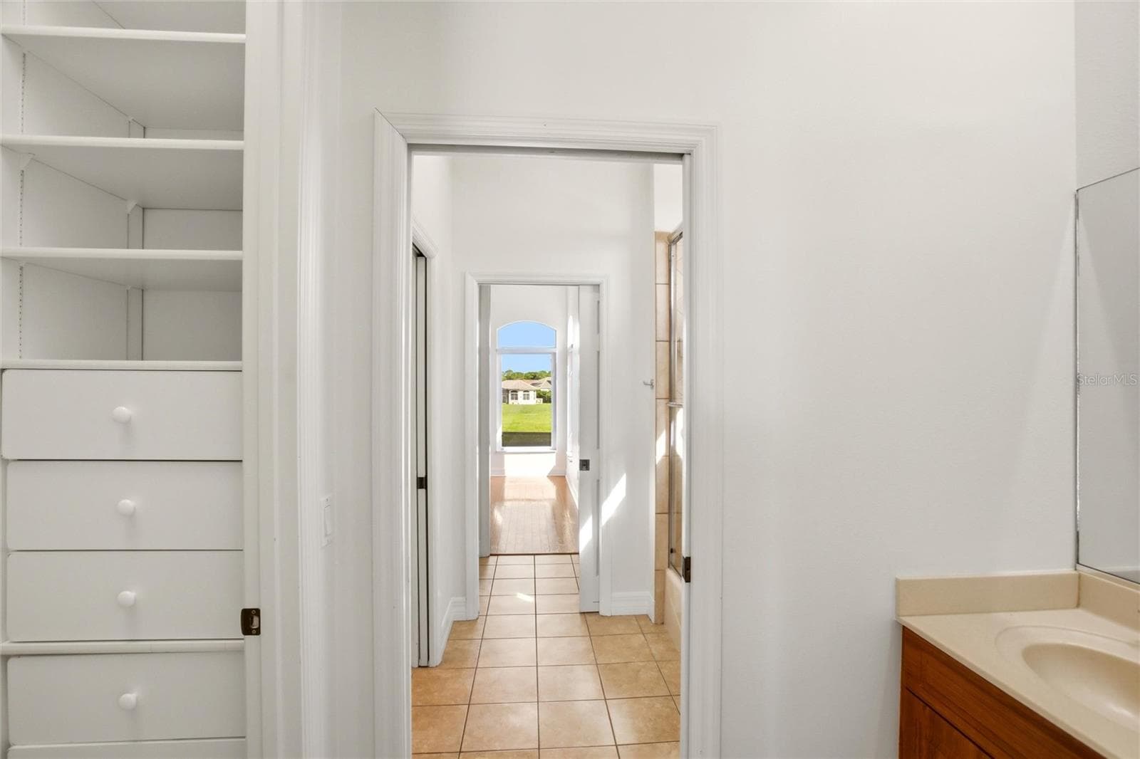 The Jack-and-Jill suites feature hardwood flooring and well-appointed bathrooms with a shower/tub combination, walk-in closets, and a private water closet. - 8417 LONE EAGLE WAY, SARASOTA