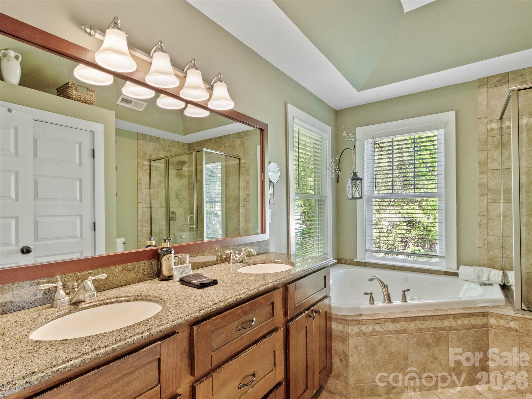 Tranquil ensuite bathroom with double vanity and spa-like bath tub - 5 Fieldtop Lane, Arden