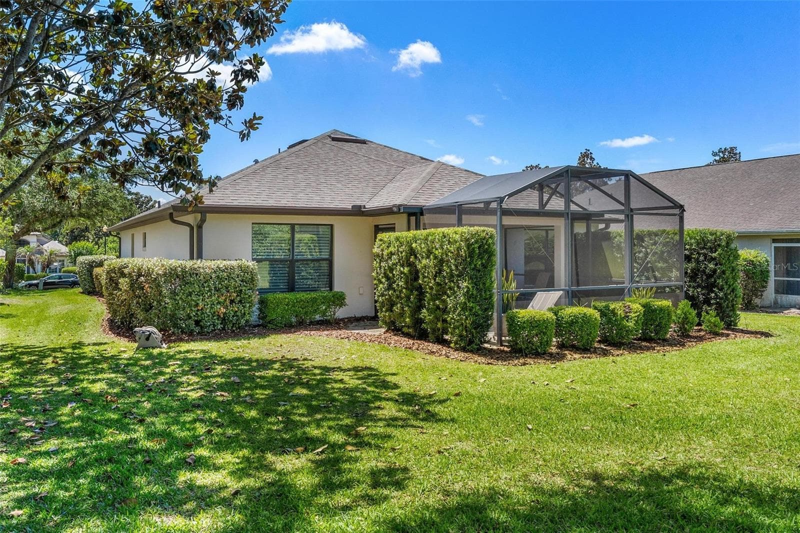 Rear/ Side view...tree shaded backyard! - 6115 LANDINGS BLVD, LADY LAKE