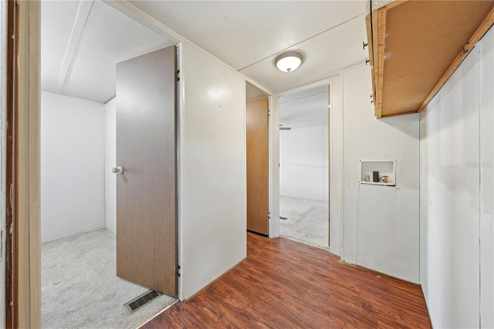 Laundry connections in hallway across from bathroom - 30107 GREEN BAY DR, TAVARES