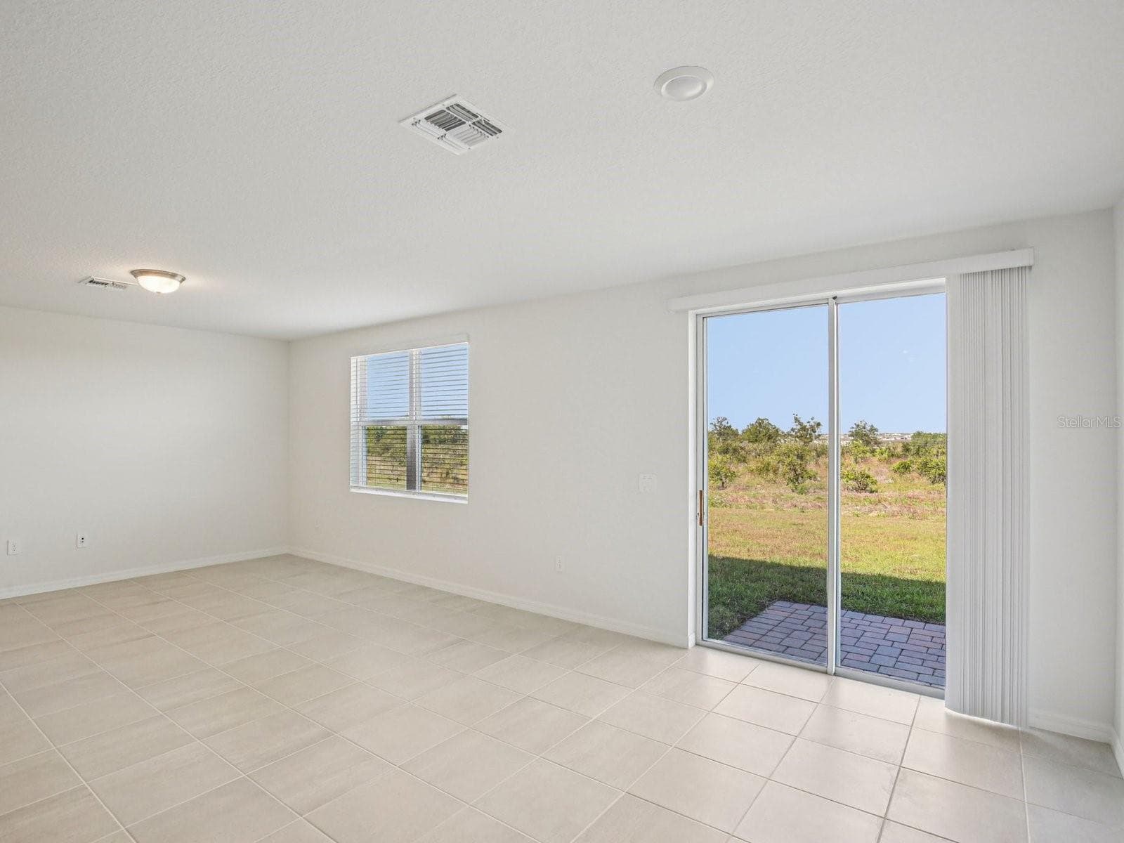 Photo is not of the actual home, but is an inspirational photo of builder’s model home and may depict options, furnishings, and/or decorator features that are not included. - 823 SUNSHOWER DR, LADY LAKE