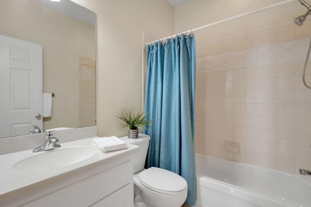 Bathroom #2 is situated directly across the hall from both secondary bedrooms. - 684 GRASSLANDS VILLAGE CIR, LAKELAND