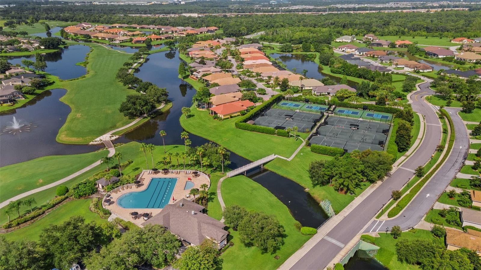 is the Deskside Pool & Tennis (and Pickleball!) facility. - 684 GRASSLANDS VILLAGE CIR, LAKELAND