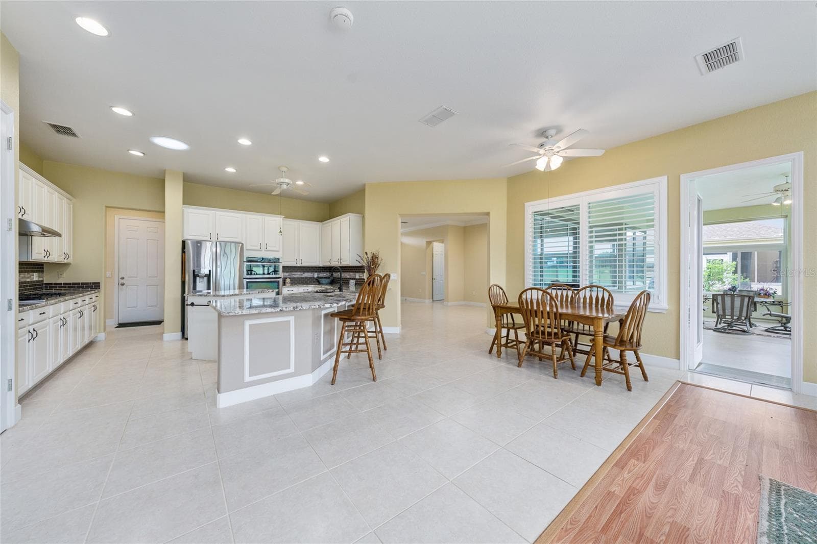breakfast area & kitchen staged - 13500 SE 97TH TERRACE RD, SUMMERFIELD